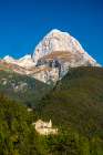 Slovenia, Triglav National Park, Julian Alps. Landscape with Mt. Mangart and castle ruin in forest. Art Print